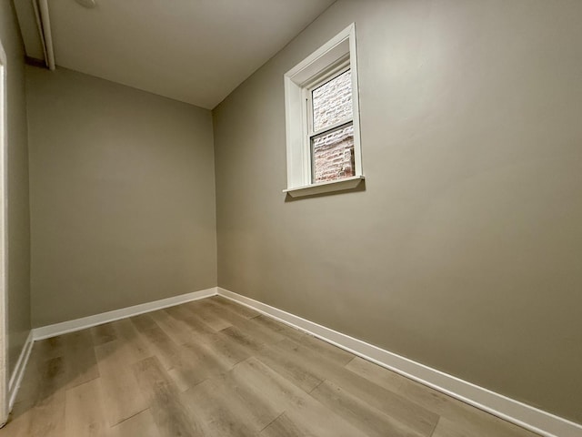 1824 W 22nd Pl, Chicago, IL 60608 - unfurnished room with light wood finished floors and baseboards