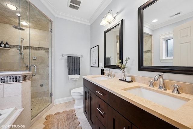 bathroom featuring a sink, ornamental molding, and visible vents