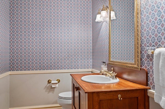 820 Lake Ave, Wilmette, IL 60091 - bathroom featuring wallpapered walls, vanity, and toilet