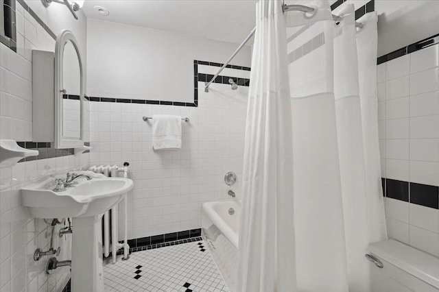 820 Lake Ave, Wilmette, IL 60091 - bathroom with tile walls, shower / bathtub combination with curtain, toilet, and tile patterned flooring