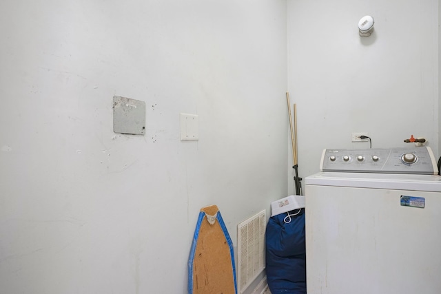 1234 S Karlov Ave, Chicago, IL 60623 - clothes washing area featuring visible vents, washer / dryer, and laundry area