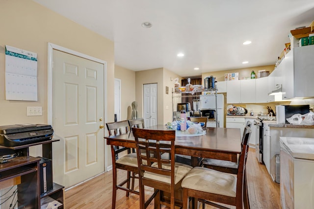 1234 S Karlov Ave, Chicago, IL 60623 - dining area with light wood-style floors and recessed lighting