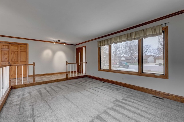 1616 N Dale Ave, Arlington Heights, IL 60004 - unfurnished room featuring light colored carpet, visible vents, baseboards, and crown molding