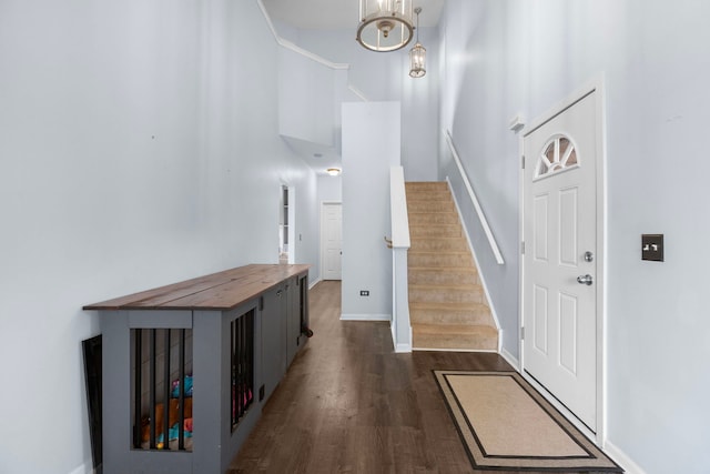 1904 Heron View Way, Round Lake, IL 60073 - foyer featuring a towering ceiling, dark wood-type flooring, stairway, baseboards, and a chandelier