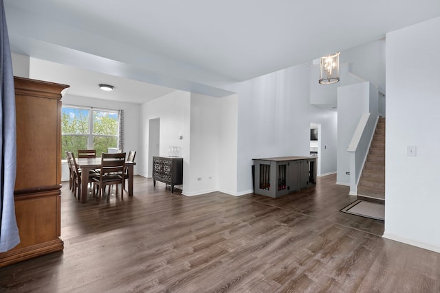 1904 Heron View Way, Round Lake, IL 60073 - living room featuring dark wood-type flooring, a chandelier, stairway, and baseboards