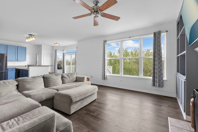 1904 Heron View Way, Round Lake, IL 60073 - living room with a ceiling fan, baseboards, and dark wood-style flooring