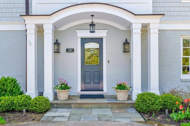 280 Old Farm Rd, Northfield, IL 60093 - view of exterior entry with brick siding and a porch