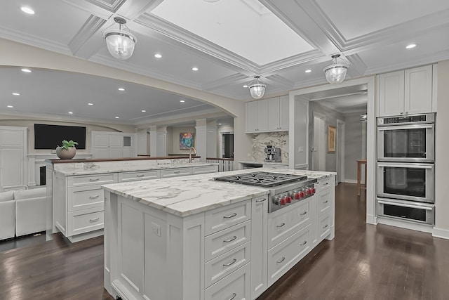 280 Old Farm Rd, Northfield, IL 60093 - kitchen with a warming drawer, a large island, appliances with stainless steel finishes, decorative columns, and ornamental molding