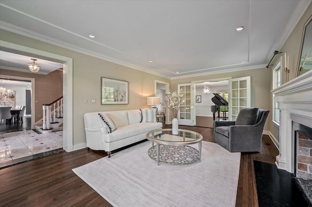 280 Old Farm Rd, Northfield, IL 60093 - living room with wood finished floors, a chandelier, ornamental molding, baseboards, and a fireplace