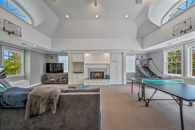 280 Old Farm Rd, Northfield, IL 60093 - rec room featuring recessed lighting, a high ceiling, plenty of natural light, a warm lit fireplace, and baseboards