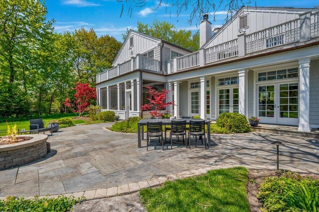 280 Old Farm Rd, Northfield, IL 60093 - view of patio / terrace with a balcony, french doors, and a fire pit