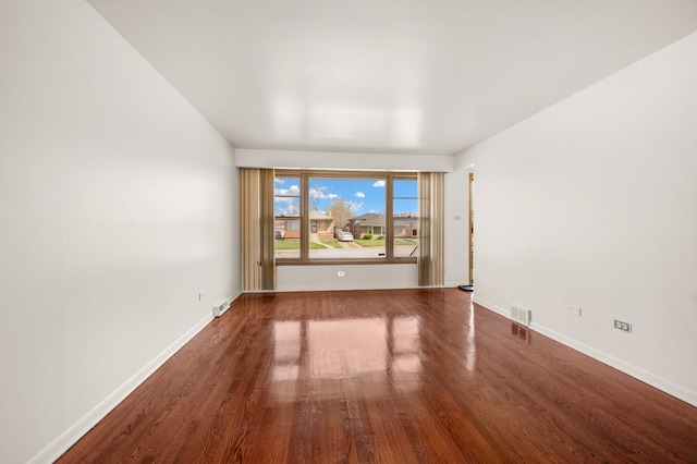 31 W 126th Pl, Chicago, IL 60628 - spare room with visible vents, baseboards, and wood finished floors