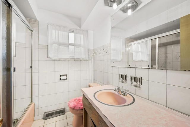 31 W 126th Pl, Chicago, IL 60628 - bathroom featuring vanity, tile patterned flooring, visible vents, enclosed tub / shower combo, and tile walls