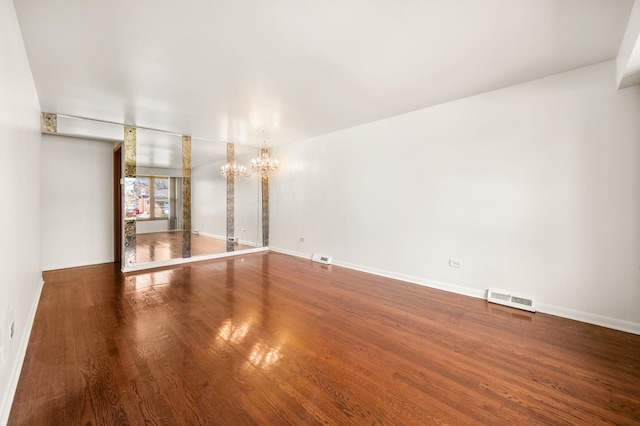 31 W 126th Pl, Chicago, IL 60628 - unfurnished living room featuring a chandelier, visible vents, baseboards, and wood finished floors