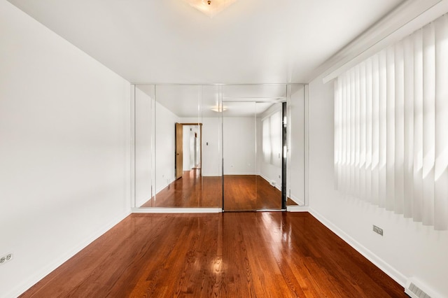 31 W 126th Pl, Chicago, IL 60628 - spare room featuring visible vents, baseboards, and wood finished floors