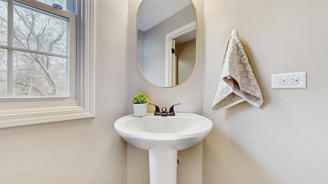 bathroom featuring a sink and plenty of natural light