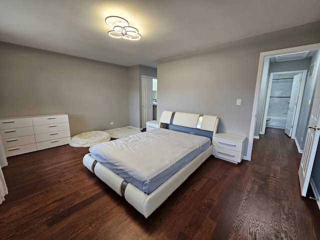 bedroom with dark wood-style floors and baseboards