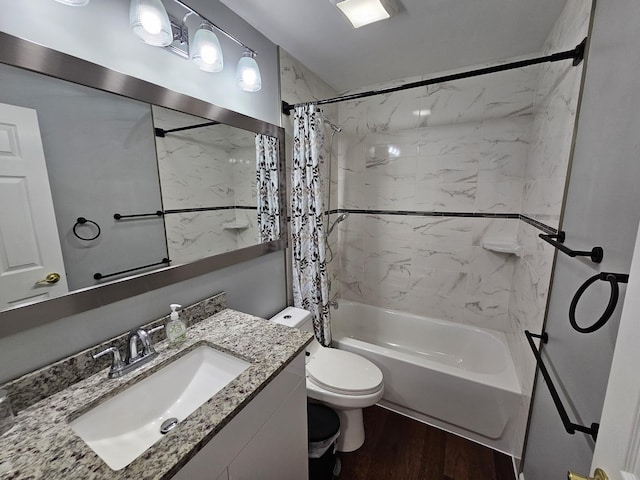 bathroom featuring shower / bath combo, toilet, vanity, and wood finished floors