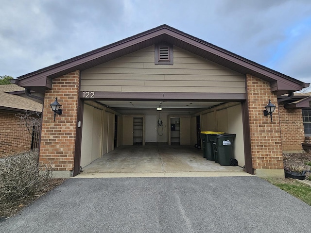 garage with aphalt driveway