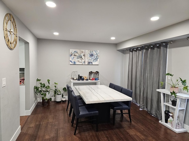 dining space with dark wood-style flooring, baseboards, and recessed lighting