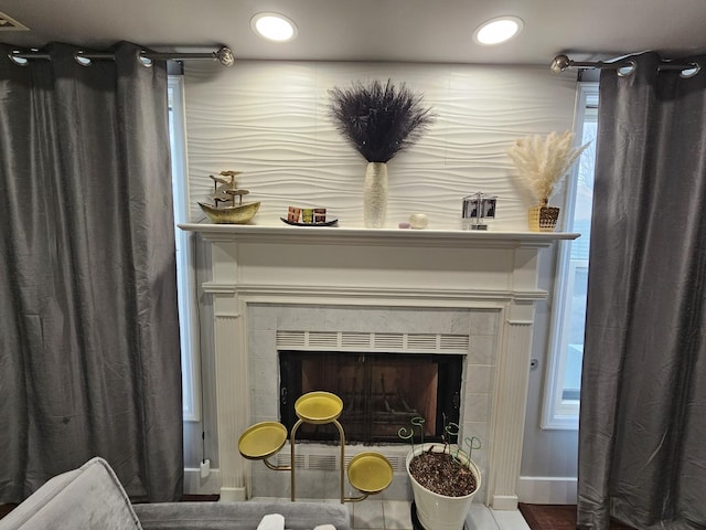 details with a tile fireplace