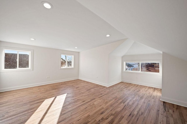 bonus room featuring recessed lighting, baseboards, and wood finished floors