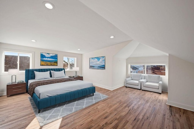 bedroom featuring baseboards, recessed lighting, and wood finished floors