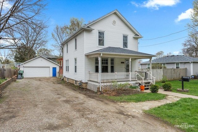 627 S Main St, Montgomery, IL 60538 - traditional style home with an outdoor structure, a porch, a garage, and fence