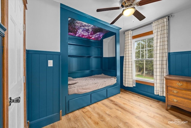 627 S Main St, Montgomery, IL 60538 - interior space with wainscoting, ceiling fan, and wood finished floors