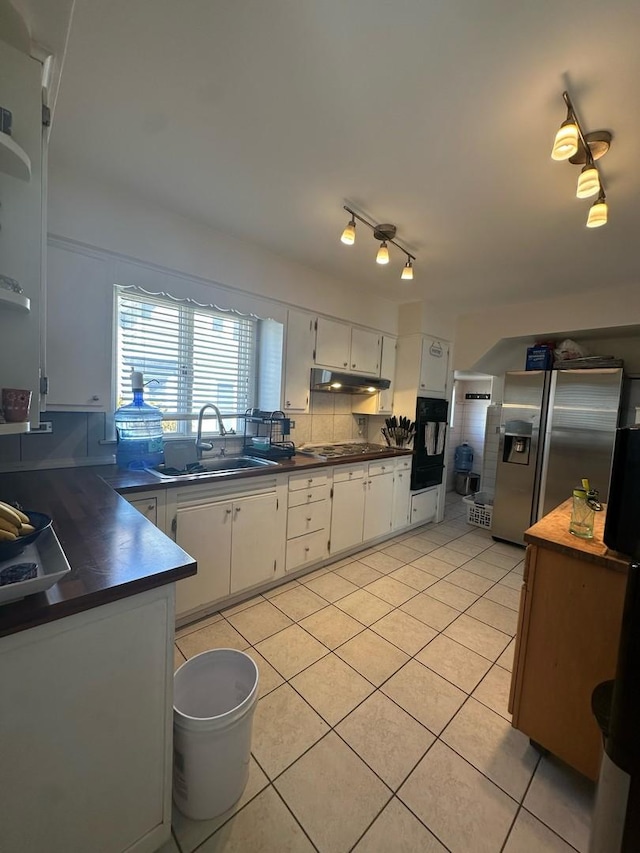 238 Ann St, West Chicago, IL 60185 - kitchen with light tile patterned floors, white cabinetry, black appliances, a sink, and dark countertops