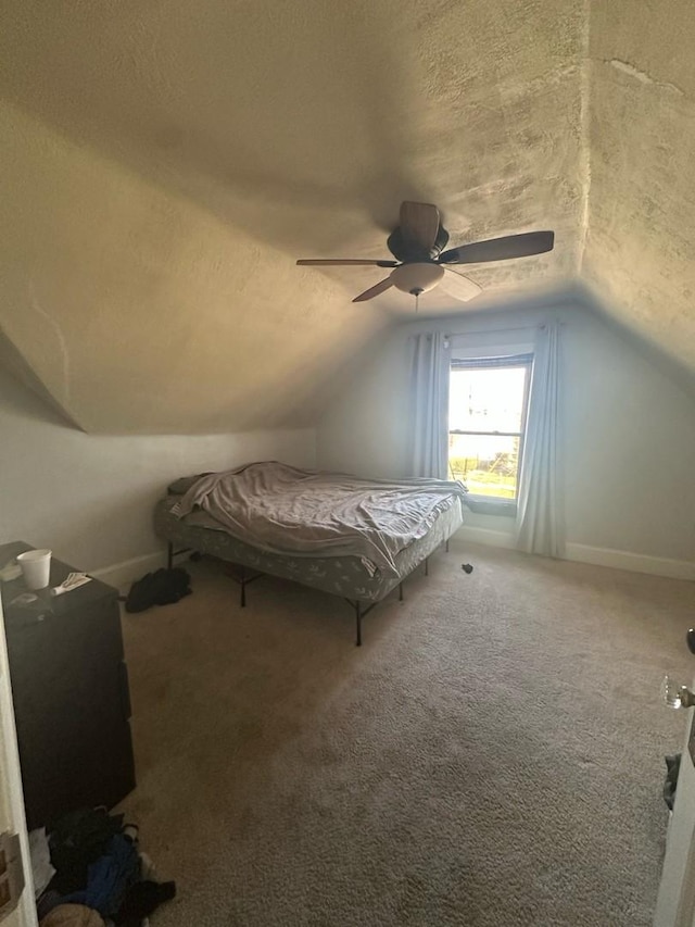 238 Ann St, West Chicago, IL 60185 - unfurnished bedroom with baseboards, vaulted ceiling, a textured ceiling, a ceiling fan, and carpet