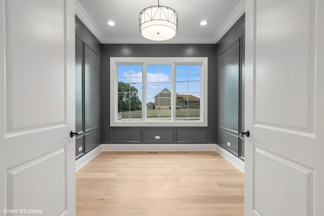 10940 German Church Rd, La Grange, IL 60525 - unfurnished room featuring crown molding, light wood-style flooring, a decorative wall, and recessed lighting
