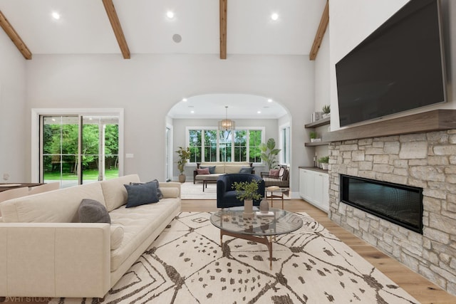 10940 German Church Rd, La Grange, IL 60525 - living area featuring light wood-style floors, arched walkways, a fireplace, and recessed lighting
