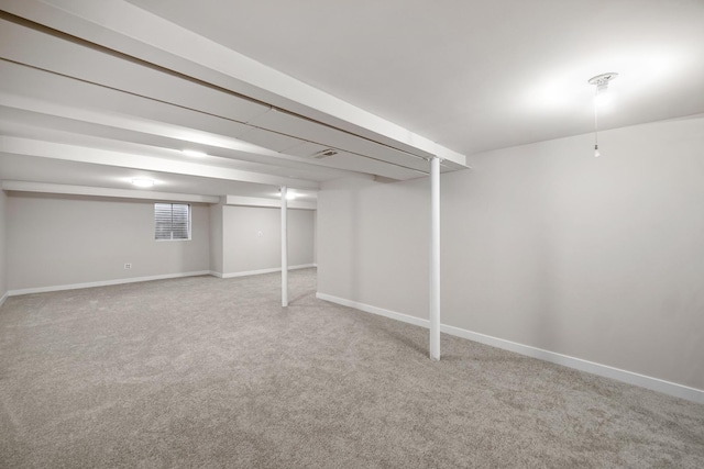 basement featuring carpet and baseboards