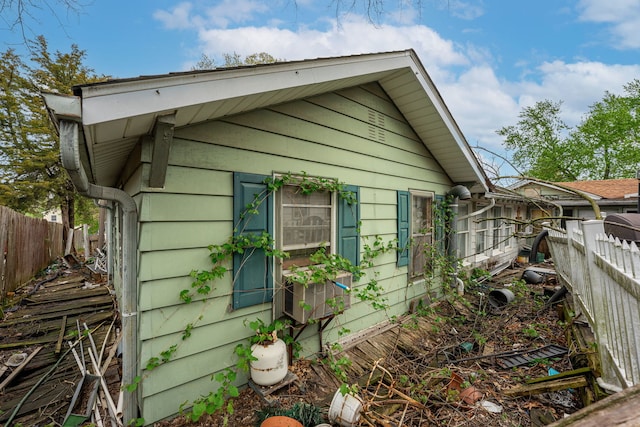 view of home's exterior with fence