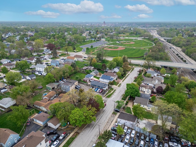 birds eye view of property with a residential view