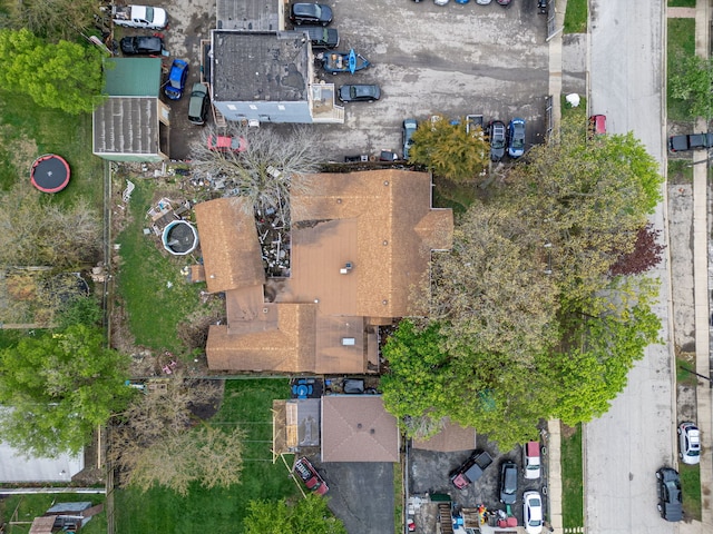 exterior space with aphalt driveway and fence