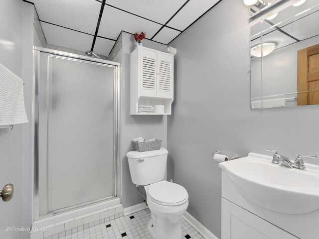 133 Abbeywood Cir, Streamwood, IL 60107 - full bath featuring a shower stall, a paneled ceiling, tile patterned floors, and toilet