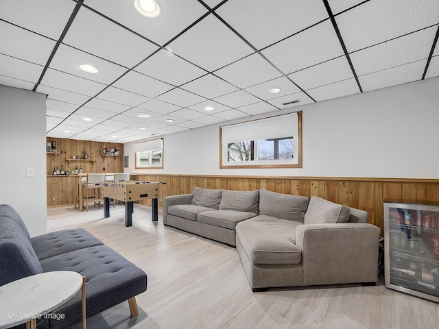 133 Abbeywood Cir, Streamwood, IL 60107 - living area featuring visible vents, wooden walls, wine cooler, recessed lighting, and wainscoting