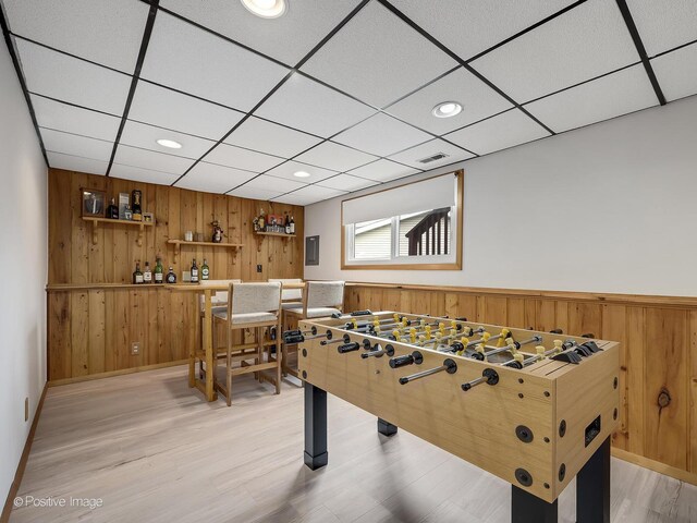 133 Abbeywood Cir, Streamwood, IL 60107 - recreation room with visible vents, a wainscoted wall, recessed lighting, wood walls, and light wood-style flooring