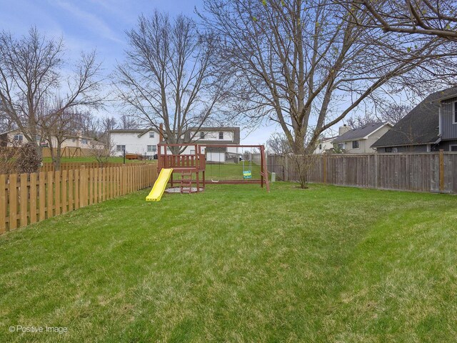 133 Abbeywood Cir, Streamwood, IL 60107 - view of yard with a fenced backyard and a playground
