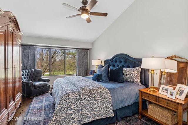 bedroom with lofted ceiling, wood finished floors, and ceiling fan