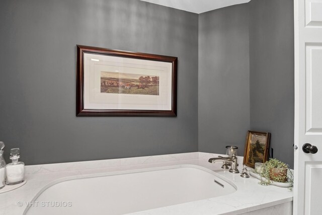 bathroom featuring a bath