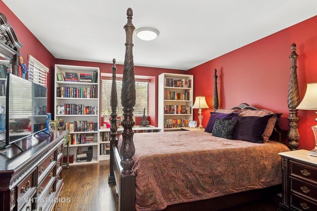 bedroom featuring wood finished floors
