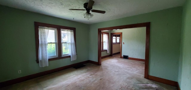 627 S 2nd St, Saint Charles, IL 60174 - carpeted spare room featuring baseboards, a textured ceiling, and a ceiling fan