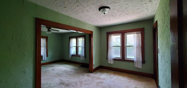 627 S 2nd St, Saint Charles, IL 60174 - spare room featuring light carpet, baseboards, and a textured ceiling