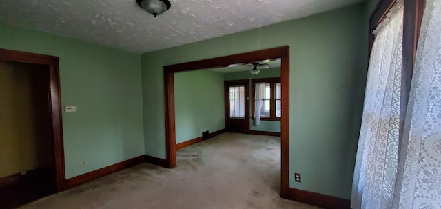 627 S 2nd St, Saint Charles, IL 60174 - empty room featuring carpet floors, baseboards, ceiling fan, and a textured ceiling