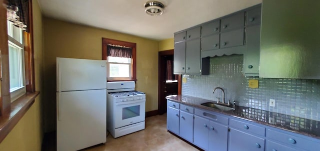 627 S 2nd St, Saint Charles, IL 60174 - kitchen featuring white appliances, a sink, tasteful backsplash, dark countertops, and gray cabinetry