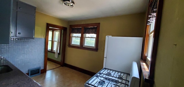 627 S 2nd St, Saint Charles, IL 60174 - doorway with tile patterned floors and baseboards