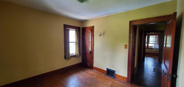 627 S 2nd St, Saint Charles, IL 60174 - empty room featuring dark wood-style flooring and baseboards